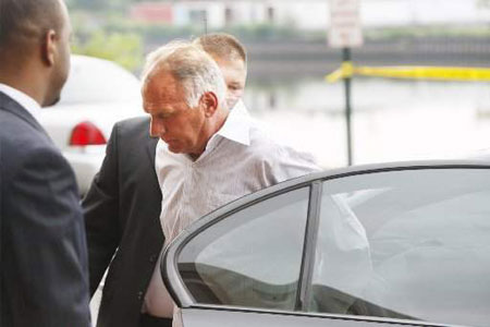 Secaucus Mayor Dennis Elwell, right, is led to FBI headquarters in Newark, N.J., after an being taken into custody early Thursday, July 23, 2009